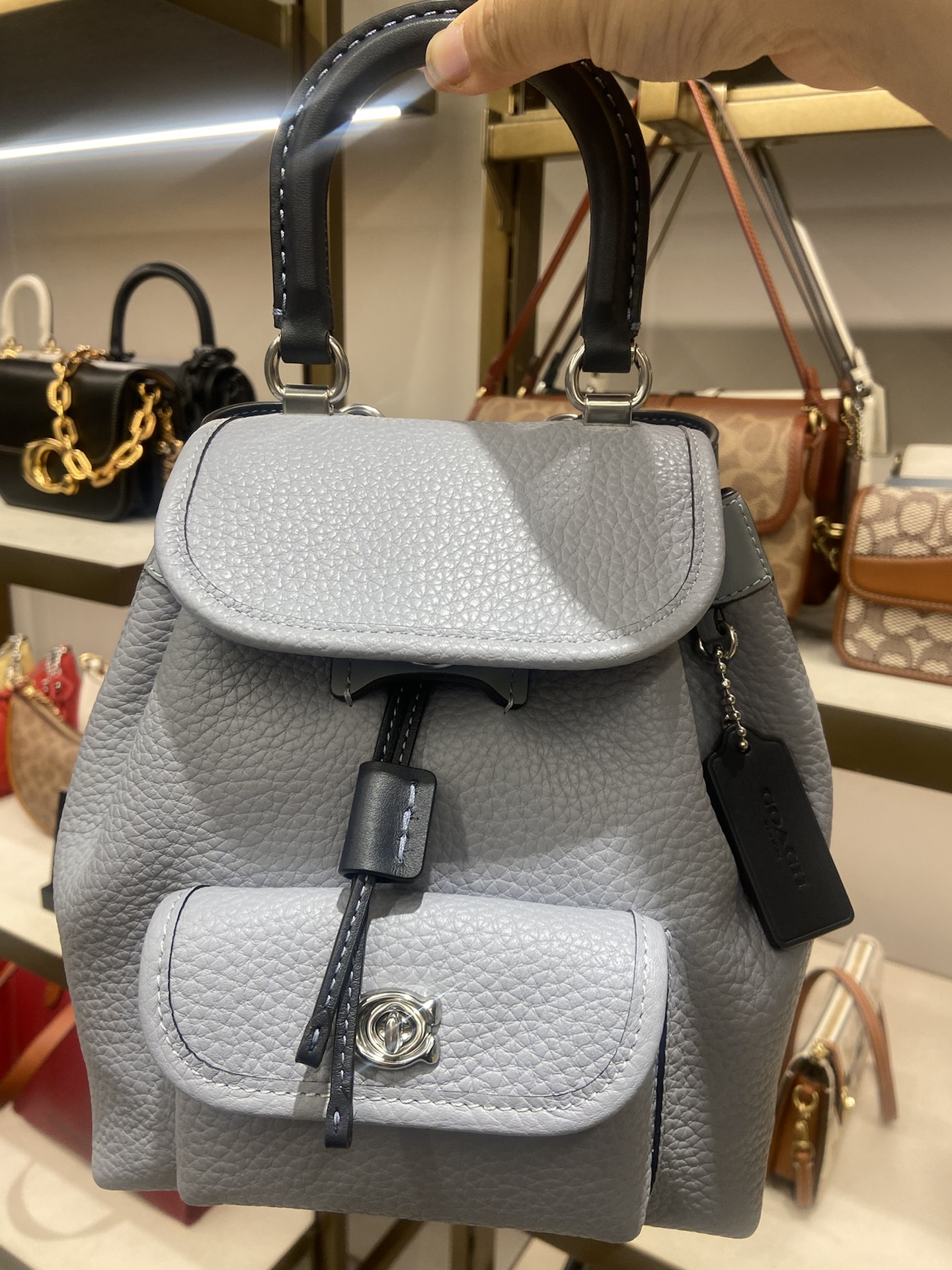 coach蔻驰 riya 23 拉绳搭扣开合 皮革 背包双肩包 中号