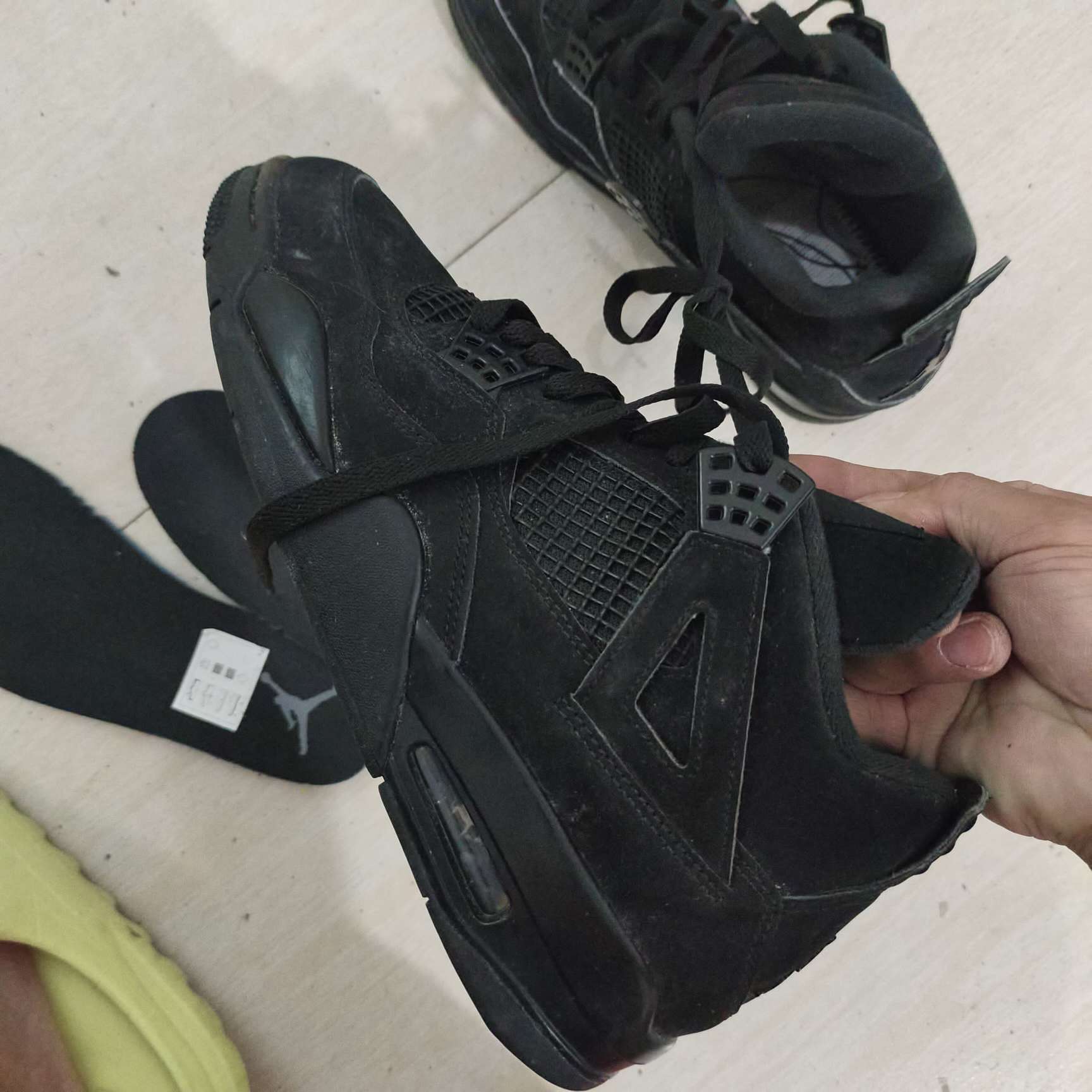 real vs fake jordan 4 black cat