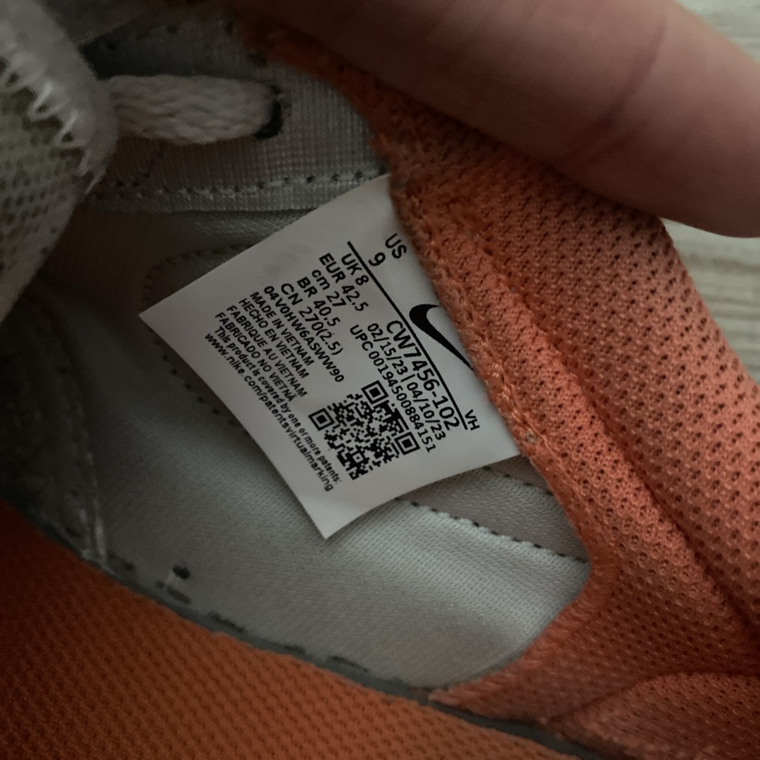 orange tag on nike shoes