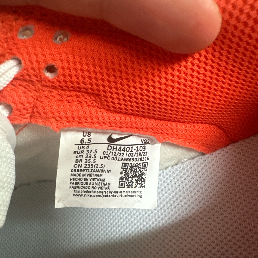 orange tag on nike shoes