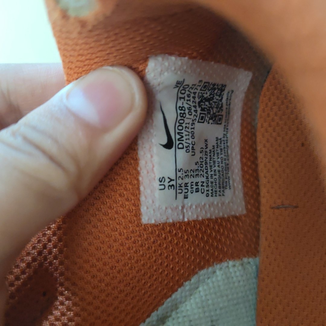 orange tag on nike shoes